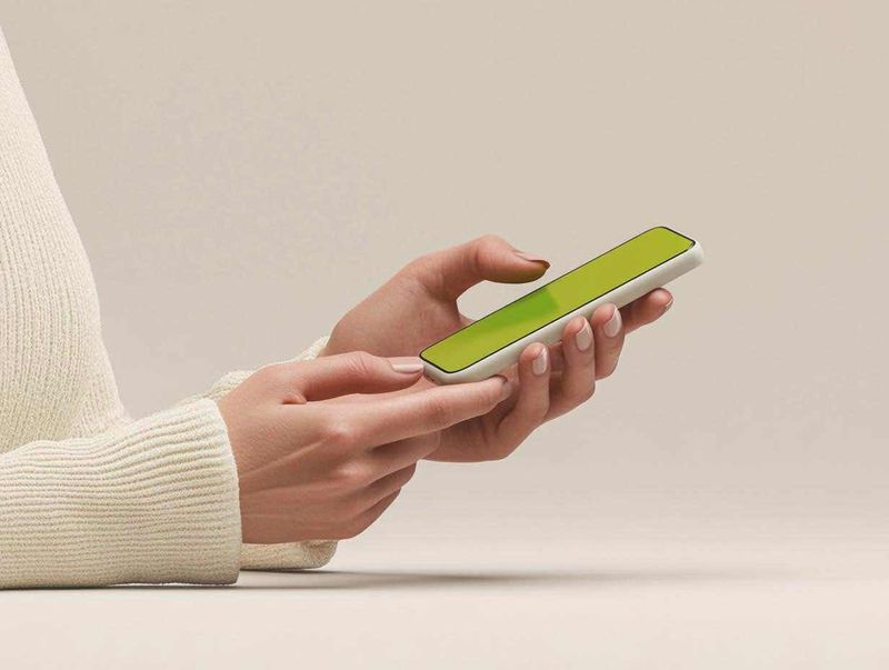 Person holding a smartphone for an evaluation